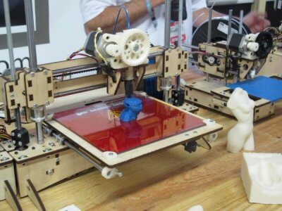 3D printer making a plastic part.